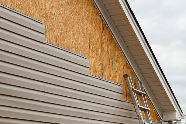 Professional Storm Damage Siding Repair technician working in Mansfield, TX